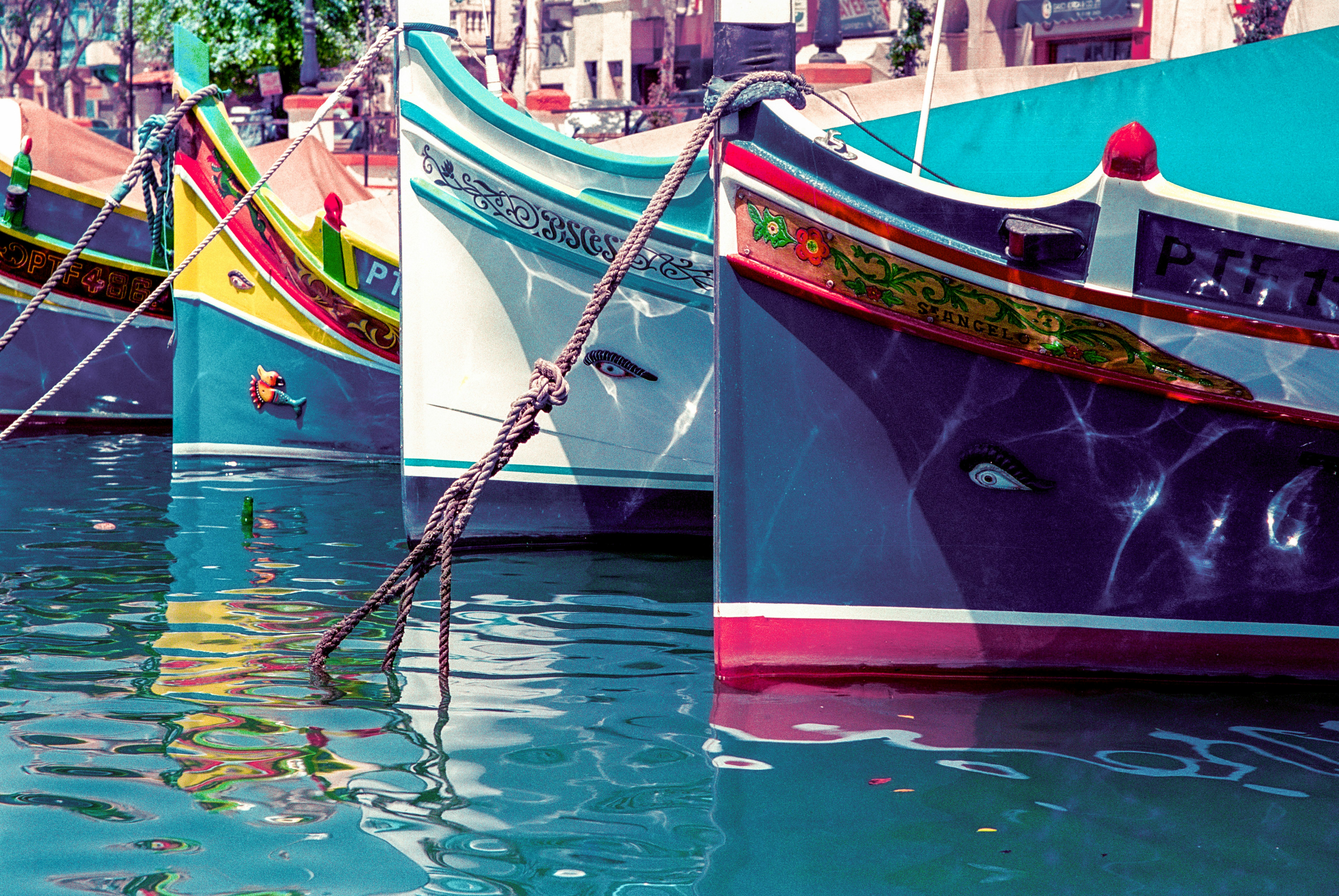 red and brown boat on water